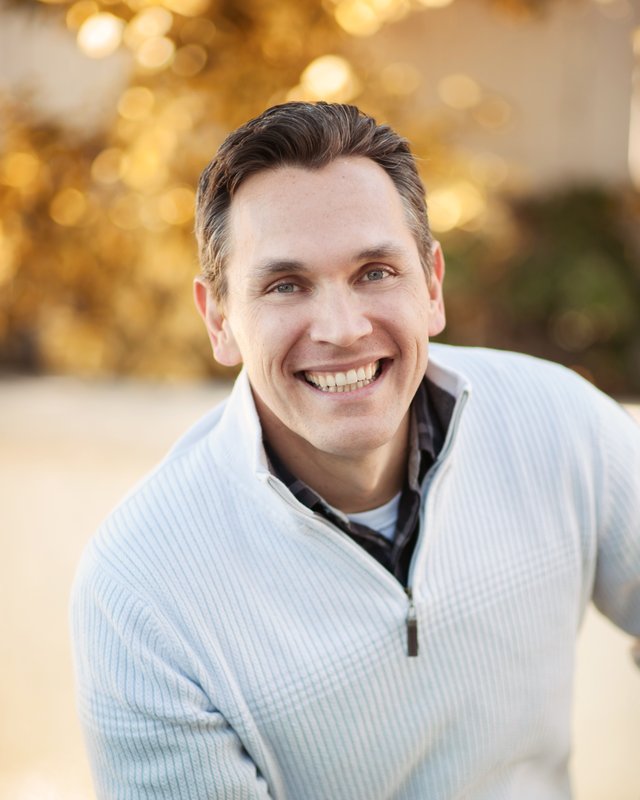 Portrait of Travis Gomez, President of CambridgeCommerce, Inc.